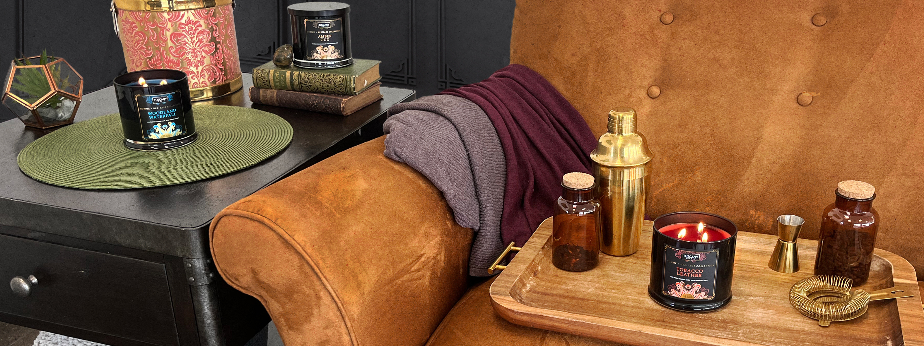 Homme + Heritage Collection displayed on a suede brown couch and modern side table.