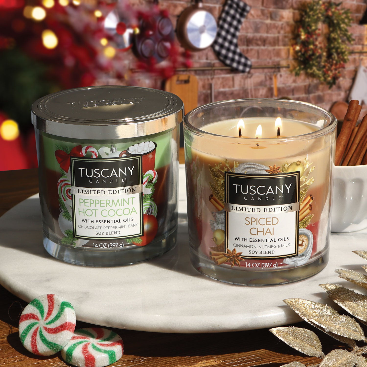 Two holiday candles are shown as part of a Christmas table