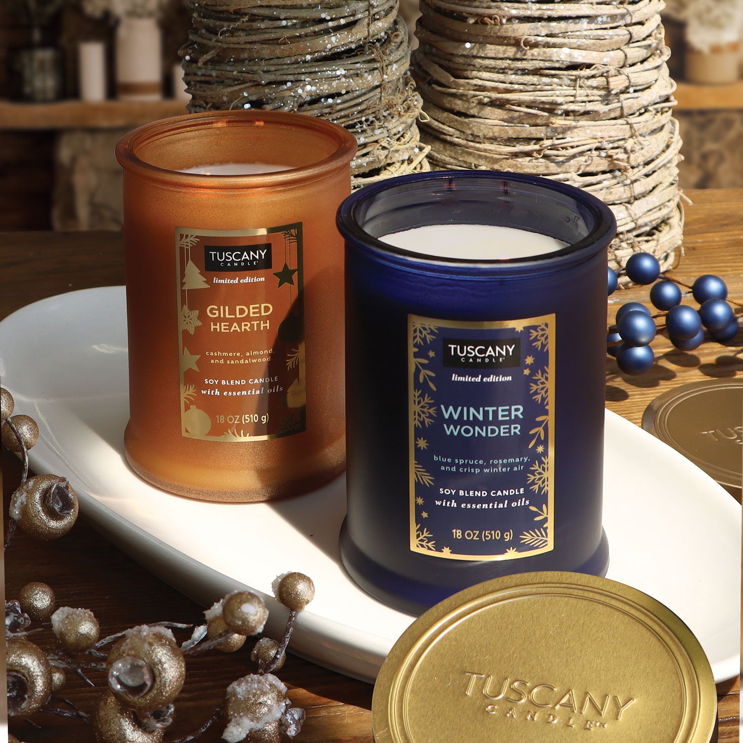 A still life photo with two winter candles from Tuscany candle
