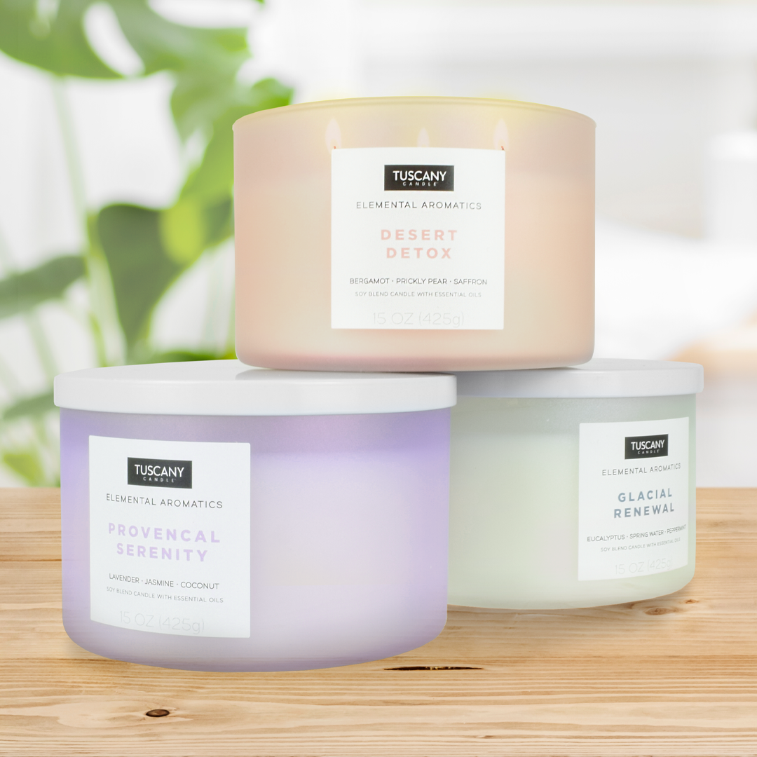 Three jars of Desert Detox Scented Jar Candles (15oz) from the Tuscany Candle Elemental Aromatics Collection on a wooden table.