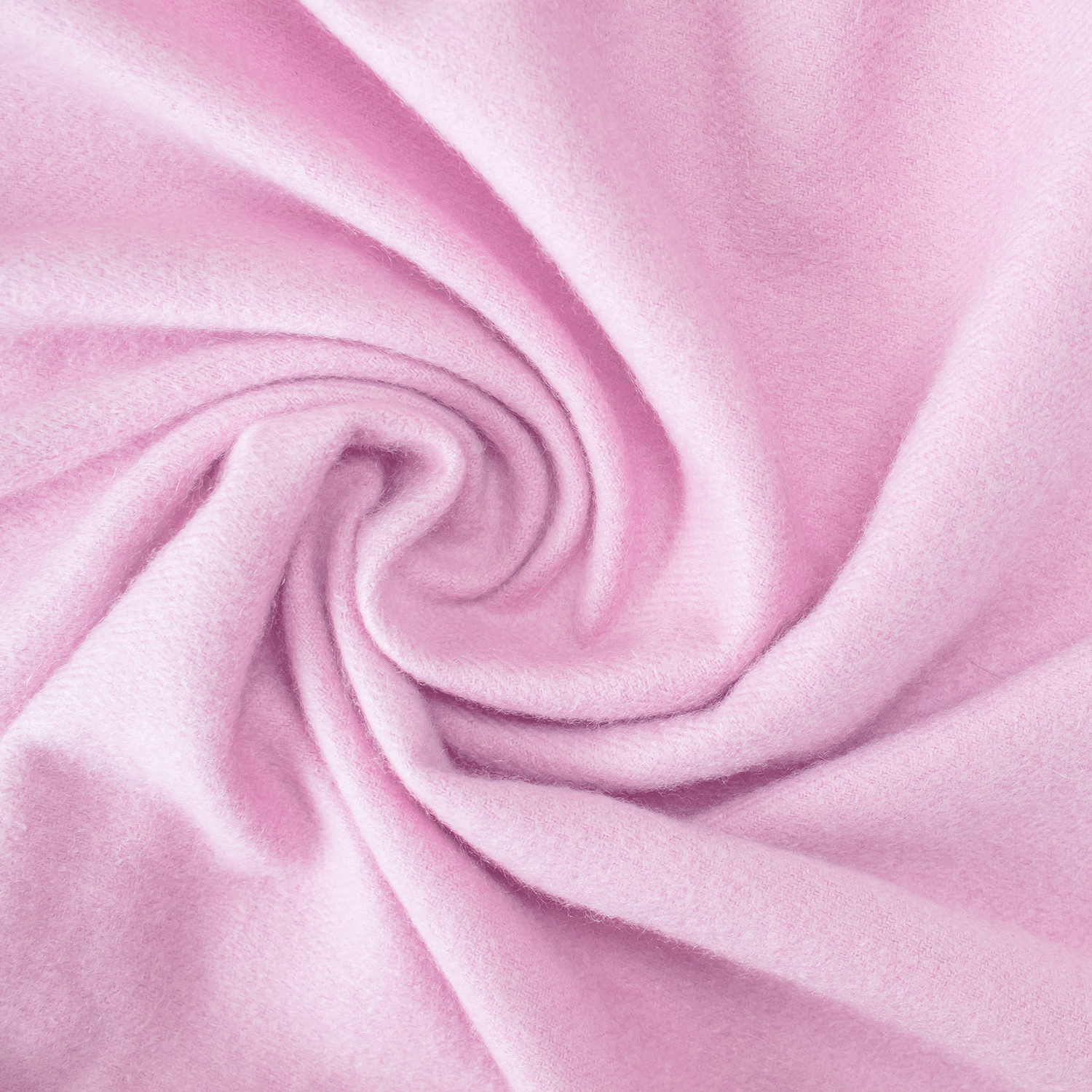 Close-up of light pink fabric swirled in a spiral, evoking the soft, cozy feel of Tuscany Candle® SEASONAL Cashmere Plum: Sandalwood & Amber Scented Fall Wax Melt (2.5 oz).