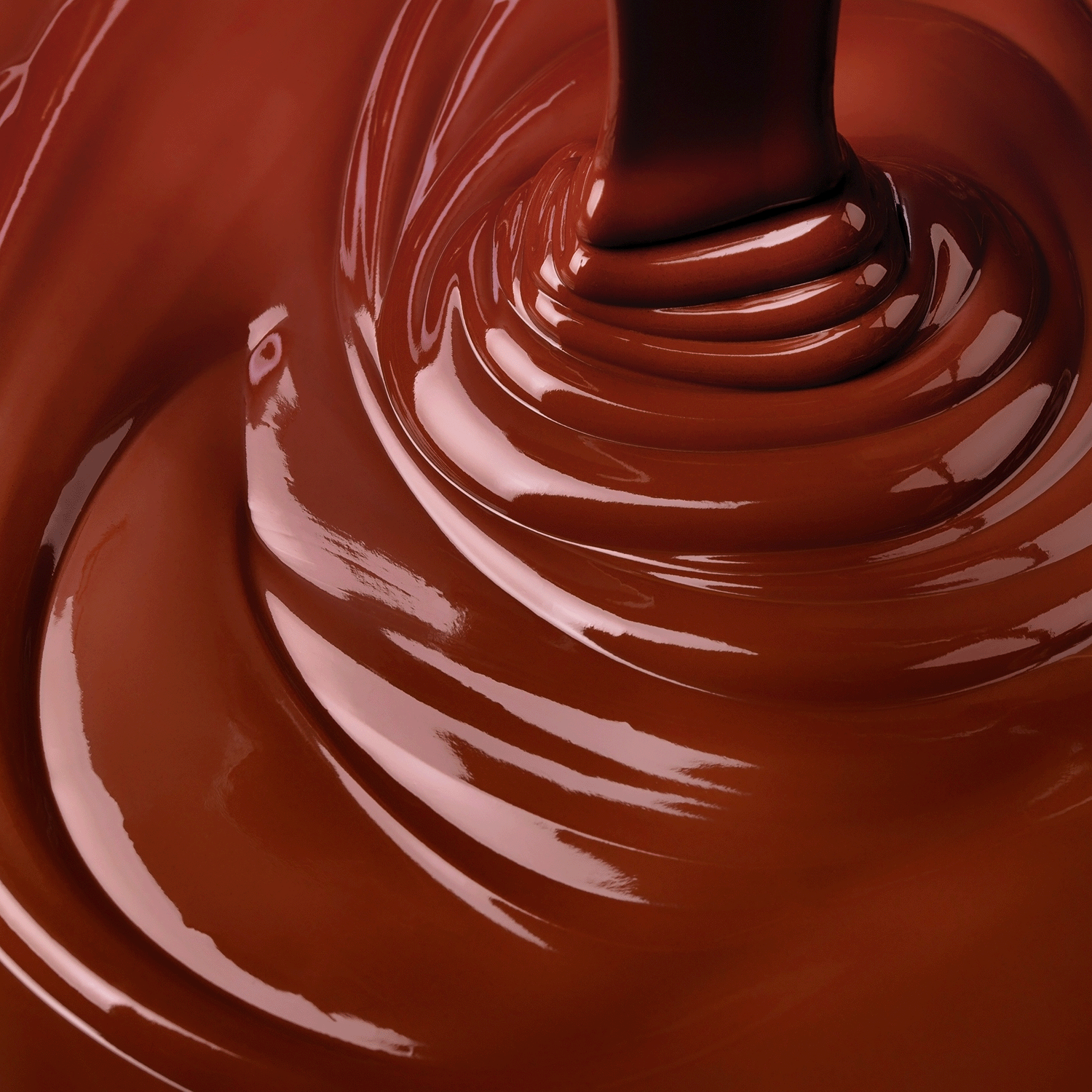 Close-up of the Tuscany Candle® SEASONAL Oozing Sweets: Brown Maple Sugar & Caramel Scented Halloween Candle (18 oz), as melted wax pours in glossy swirls with a rich maple sugar and caramel aroma.