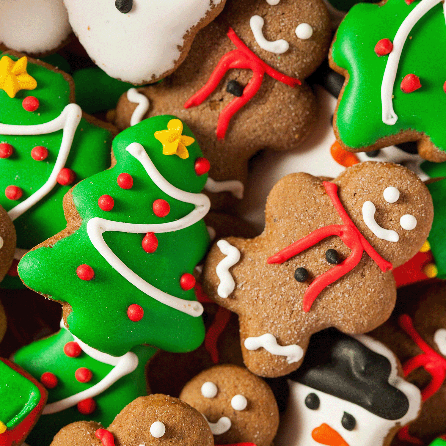 Enjoy Tuscany Candle® SEASONAL's Gingerbread Village: Classic Gingerbread & Sugar Scented Holiday Candle (14 oz) from the Traditions Collection—perfect for adding holiday warmth as you savor festive Christmas cookies.