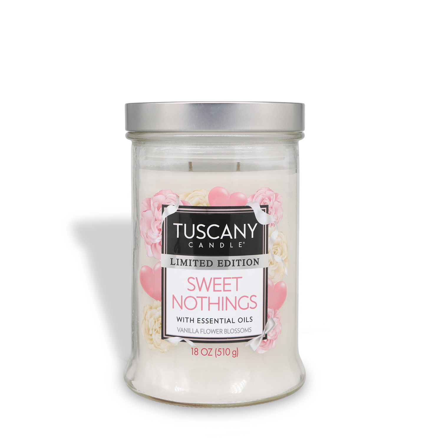 An 18 oz Tuscany Candle® SEASONAL "Sweet Nothings: Violet & Magnolia Scented Valentine's Candle" in a clear glass jar with silver lid.