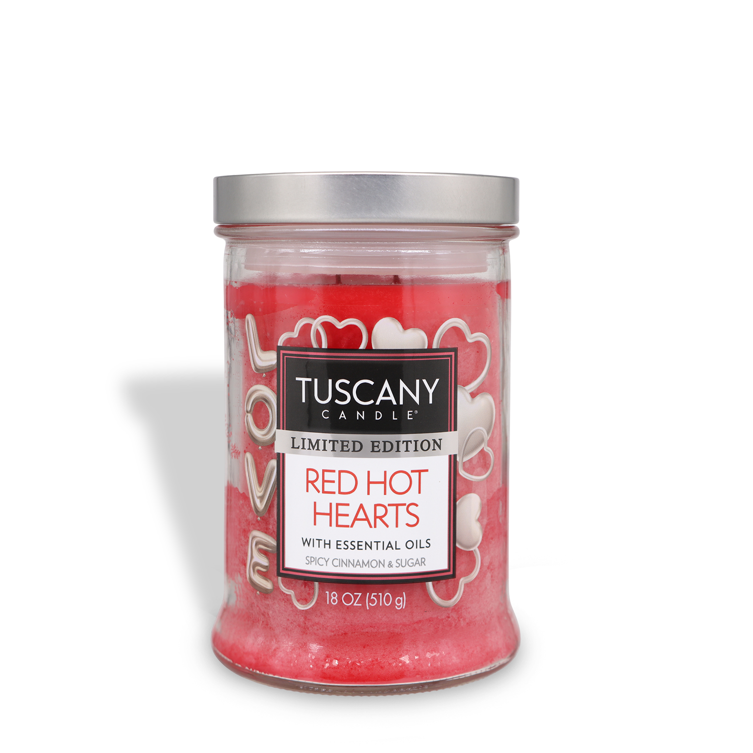 An 18 oz Tuscany Candle® SEASONAL "Red Hot Hearts: Red Hot Cinnamon Scented Valentine's Candle" features red wax, white heart designs, and "LOVE" on the side, with a spicy cinnamon and sugar fragrance.