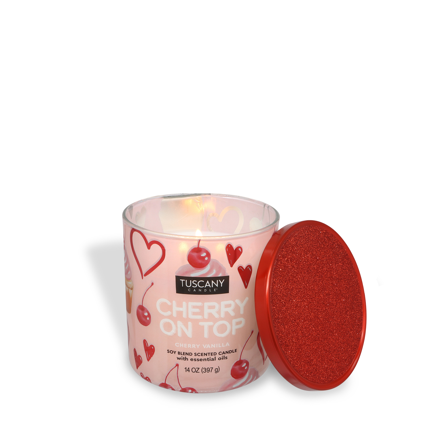 The Tuscany Candle® SEASONAL Cherry On Top: Cherry Vanilla Scented Valentine's Candle (14 oz) features heart and cherry designs on a glass jar, shown next to its red glittery lid.