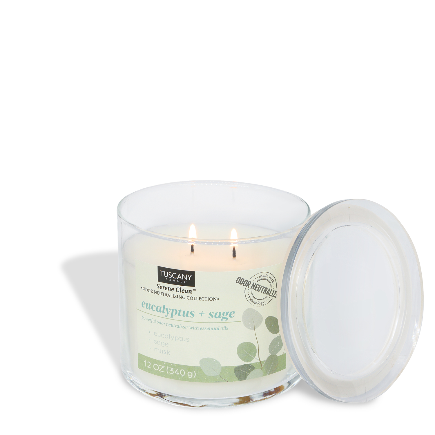 A lit Tuscany Candle® Everyday Eucalyptus + Sage Scented Odor Neutralizing Candle (12 oz) from the Serene Clean Collection sits in a glass jar with two wicks and a clear lid beside it.