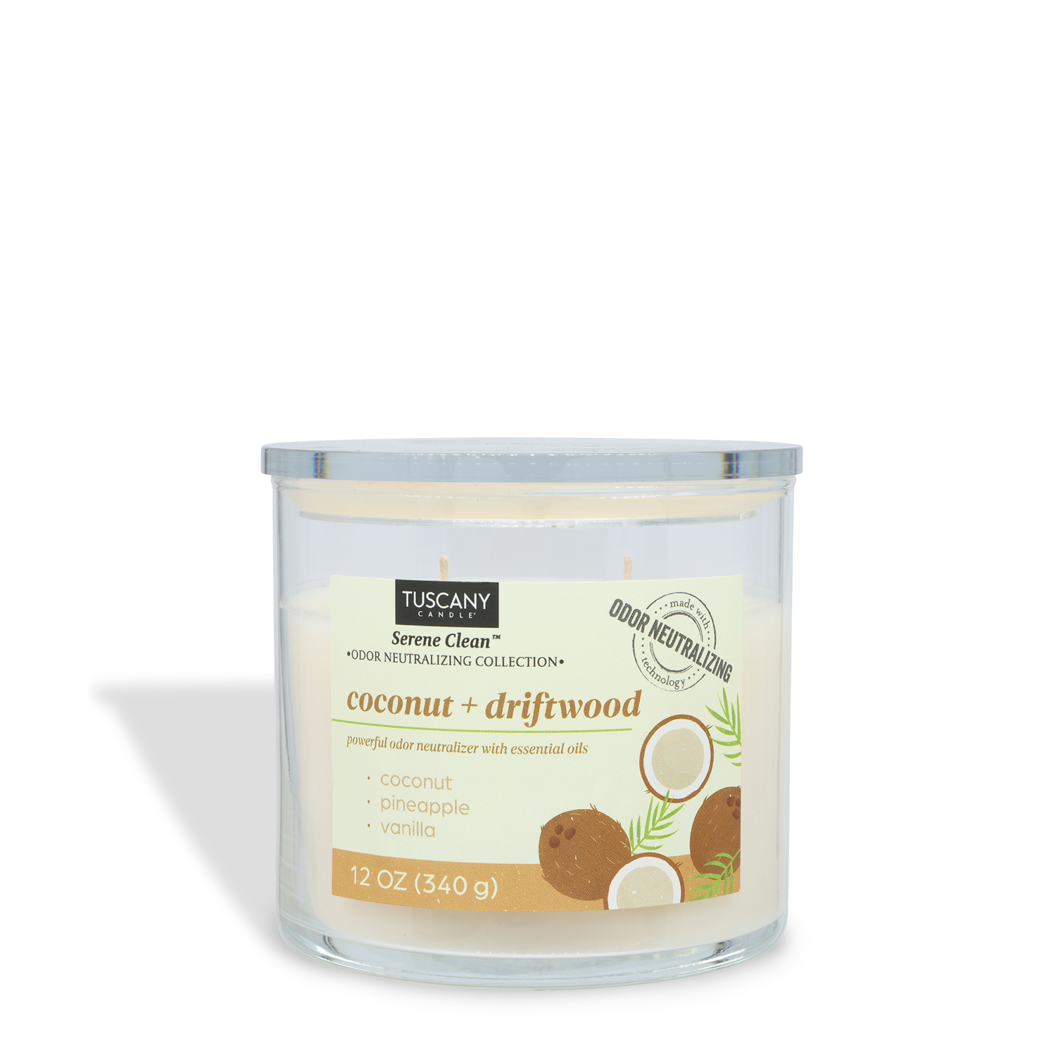 The Tuscany Candle® Everyday Coconut + Driftwood Scented Odor Neutralizing Candle (12 oz) from the Serene Clean Collection features essential oils and comes in a clear glass jar with coconut and pineapple images on the label.