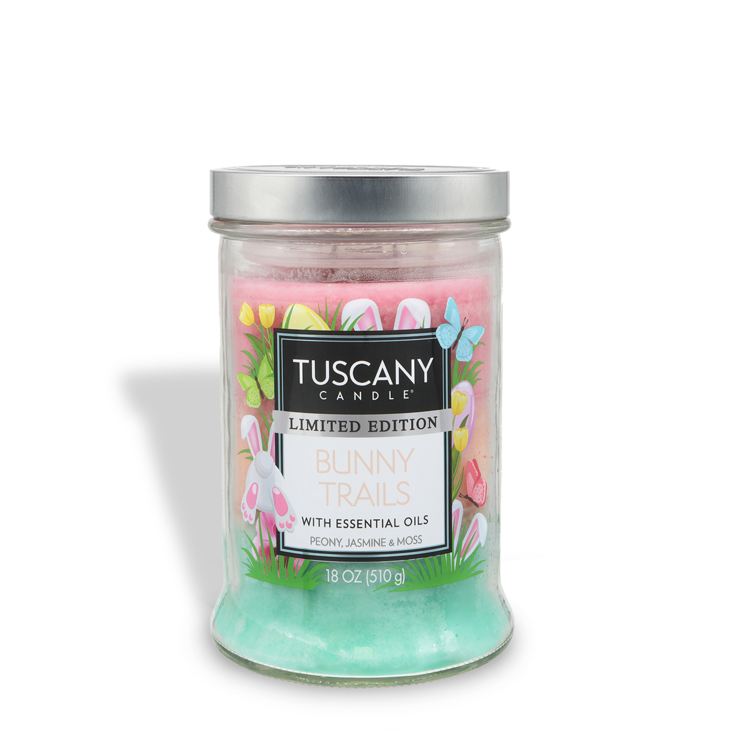 The Tuscany Candle® Bunny Trails: Peony & Jasmine Scented Easter Candle (18 oz) features pastel pink and green wax in a glass jar with a silver lid and offers notes of peony, jasmine, and moss.