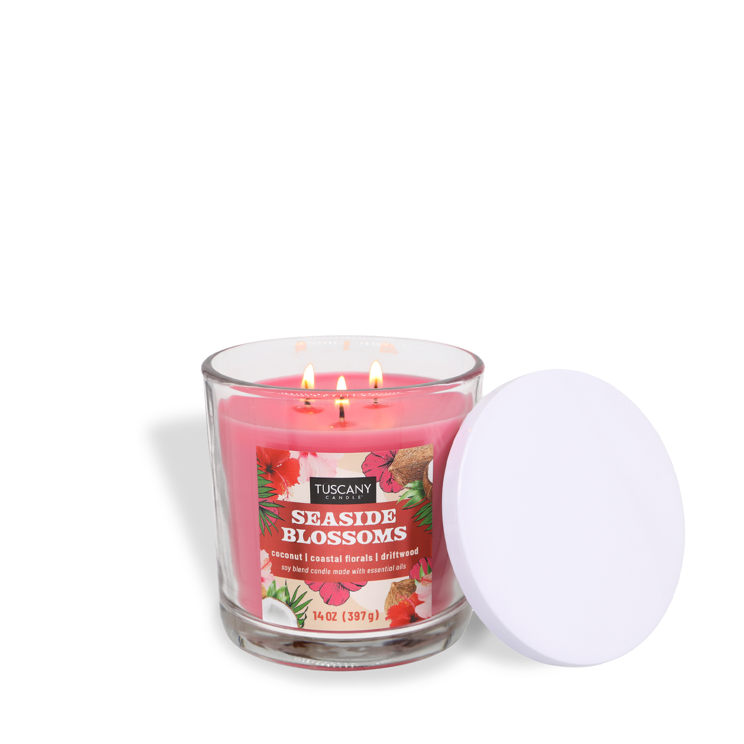 The Tuscany Candle® SEASONAL Seaside Blossoms: Coconut & Floral Scented Spring Candle (14 oz) features pink wax, a white lid, and three lit wicks, bringing refreshing coastal spring fragrance into your home.