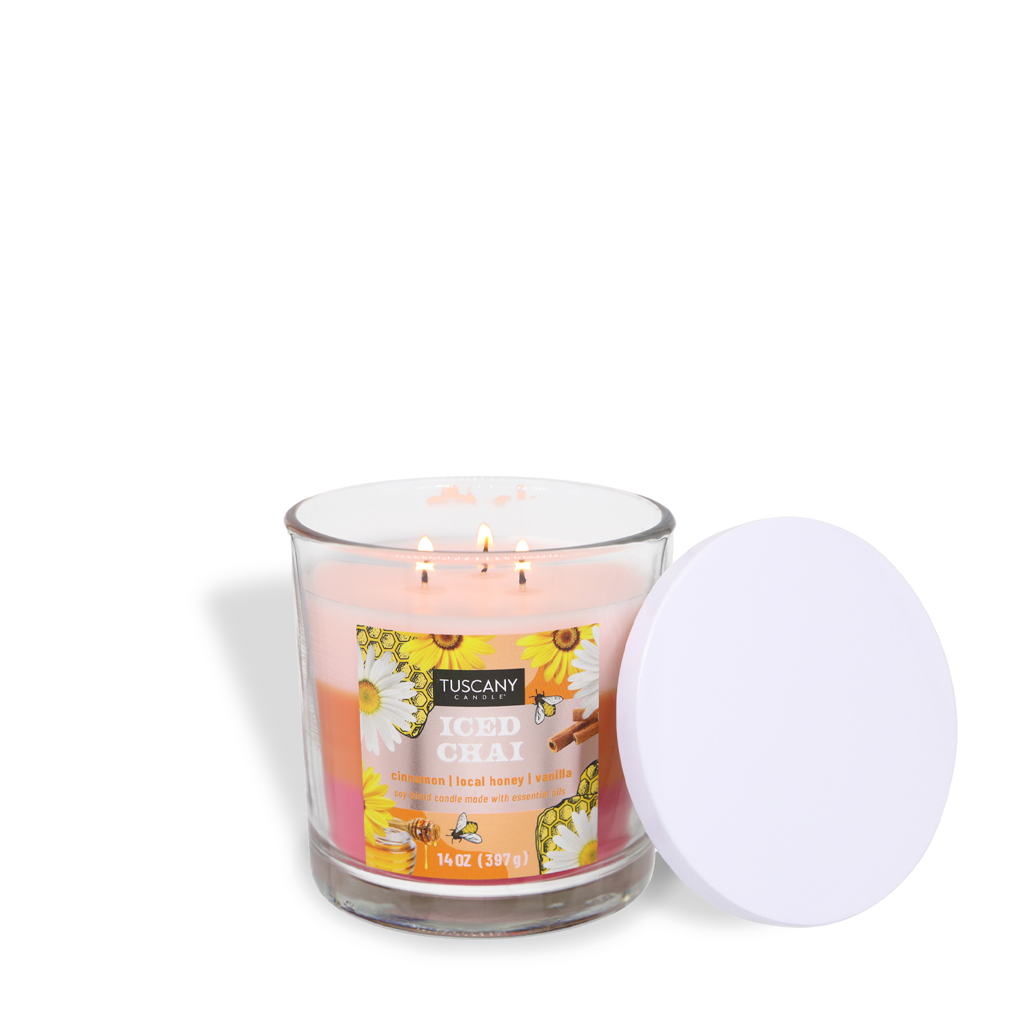 The Tuscany Candle® SEASONAL Iced Chai: Cardamom & Honey Scented Spring Candle (14 oz) comes in a glass jar with three lit wicks, floral label graphics, and a white lid—perfect for a refreshing spring ambiance.