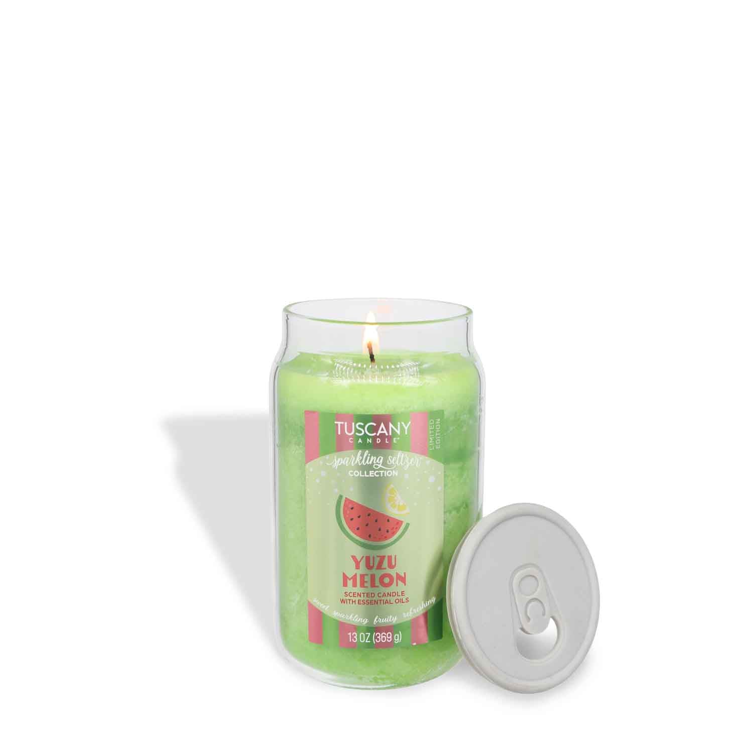 A lit Tuscany Candle® SEASONAL Yuzu Melon: Sparkling Seltzer Scented Summer Candle (13 oz) in a glass jar, labeled and topped with a soda can-style removable lid placed beside it.