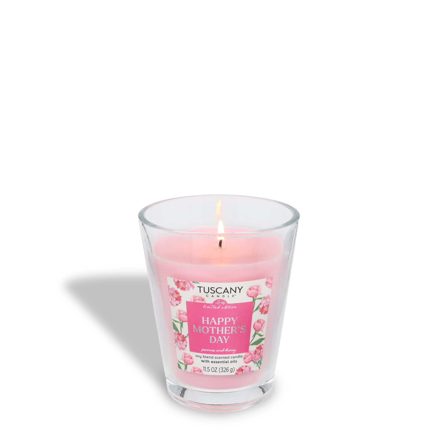 A lit pink Tuscany Candle® SEASONAL "Happy Mother's Day: Peonies & Honey Scented Spring Candle" (11.5 oz) in a clear glass jar, with floral label decorations and a fresh spring fragrance.