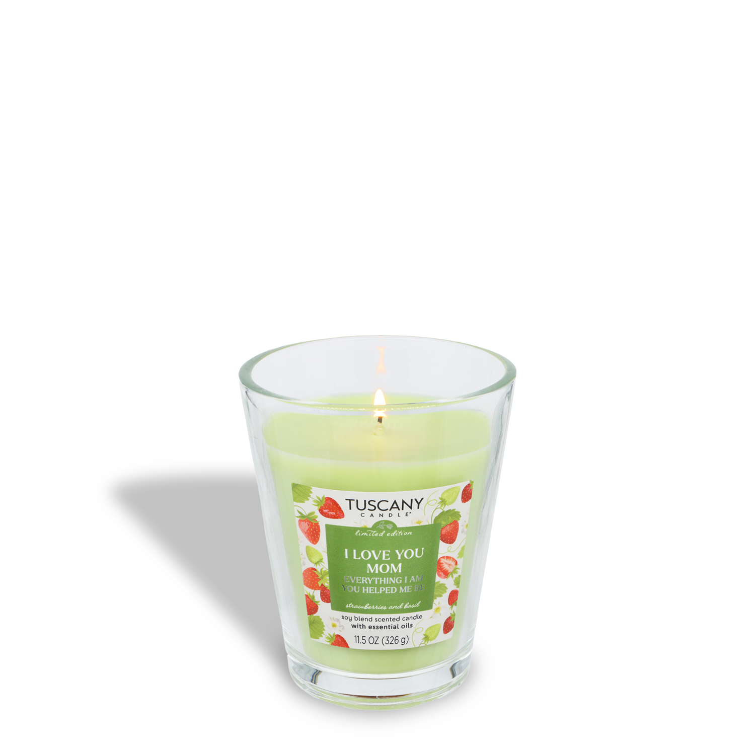 A lit Tuscany Candle® SEASONAL "I Love You Mom: Strawberries & Basil" spring candle (11.5 oz) in a clear jar with a floral-strawberry design—perfect for Mother’s Day.