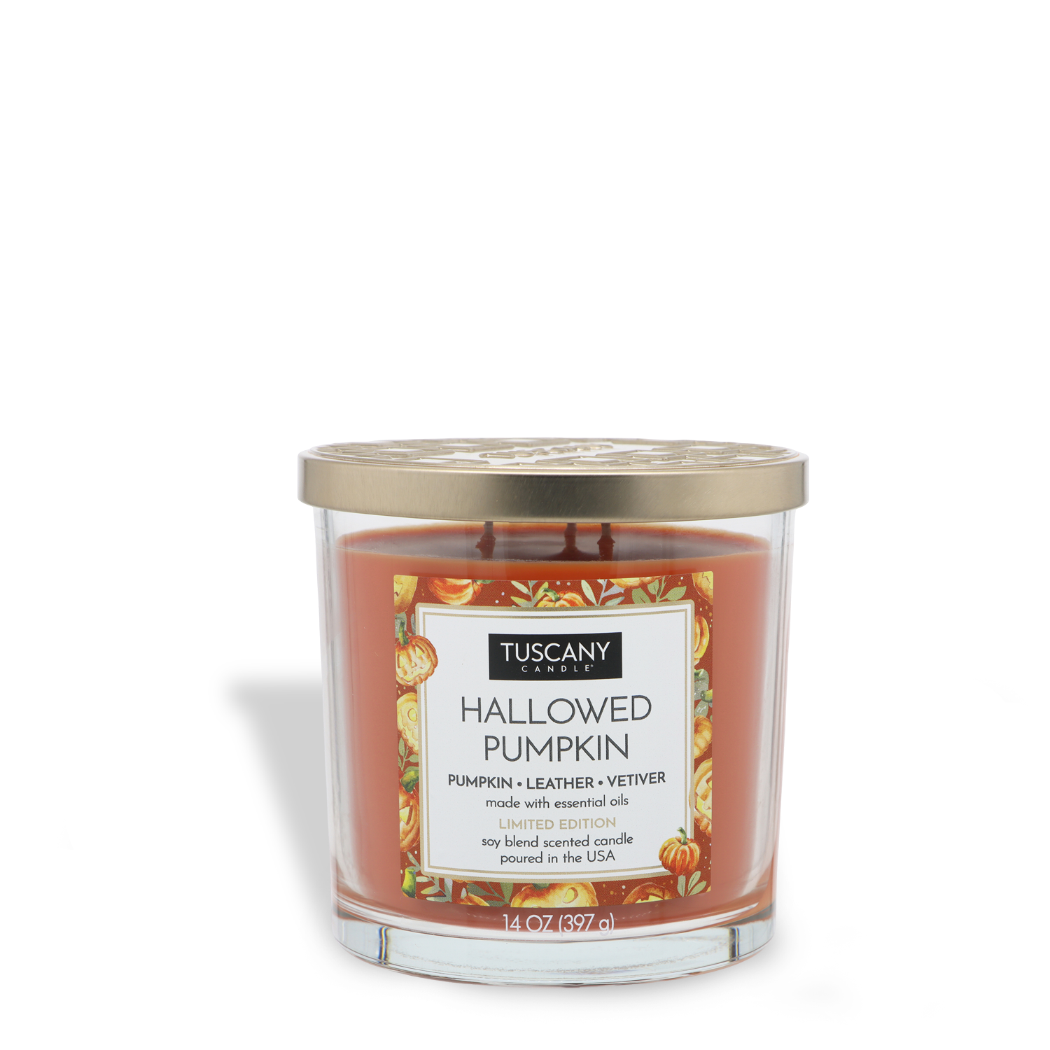 A 14 oz glass jar candle with orange wax, labeled “Tuscany Candle® SEASONAL Hallowed Pumpkin: Pumpkin & Leather Scented Halloween Candle,” features pumpkin, leather, and vetiver fragrances and comes with a gold lid.