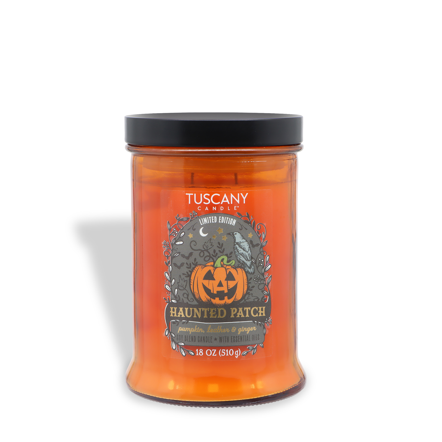 A Tuscany Candle® SEASONAL “Haunted Patch: Pumpkin, Leather & Ginger Scented Halloween Candle” (18 oz) in an orange glass jar with a jack-o’-lantern design and black lid.