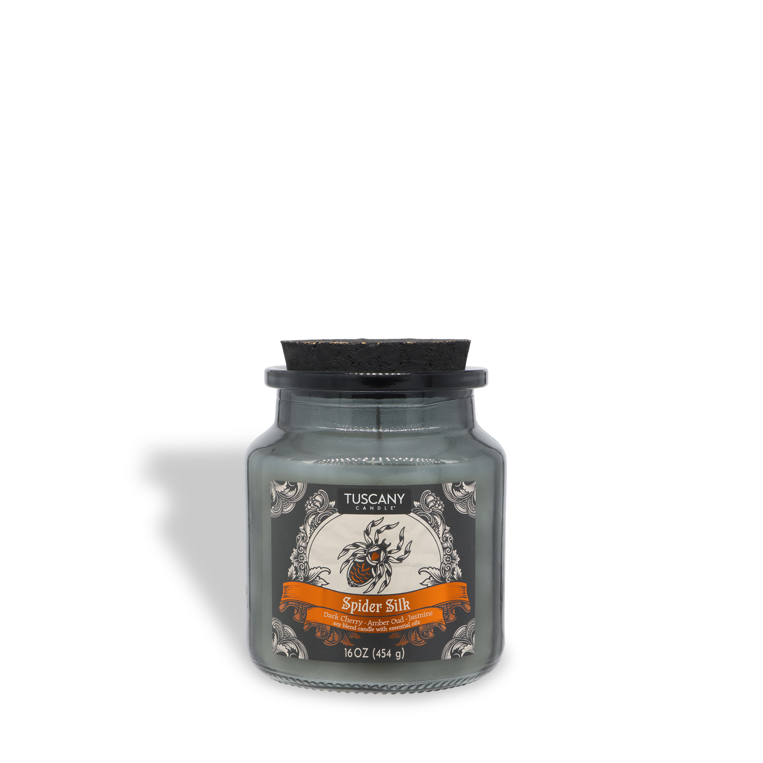A 16 oz (454 g) gray wax glass jar candle from Tuscany Candle® SEASONAL, labeled “Spider Silk: Dark Cherry & Amber Oud Scented Halloween Candle,” featuring a black lid and decorative label.