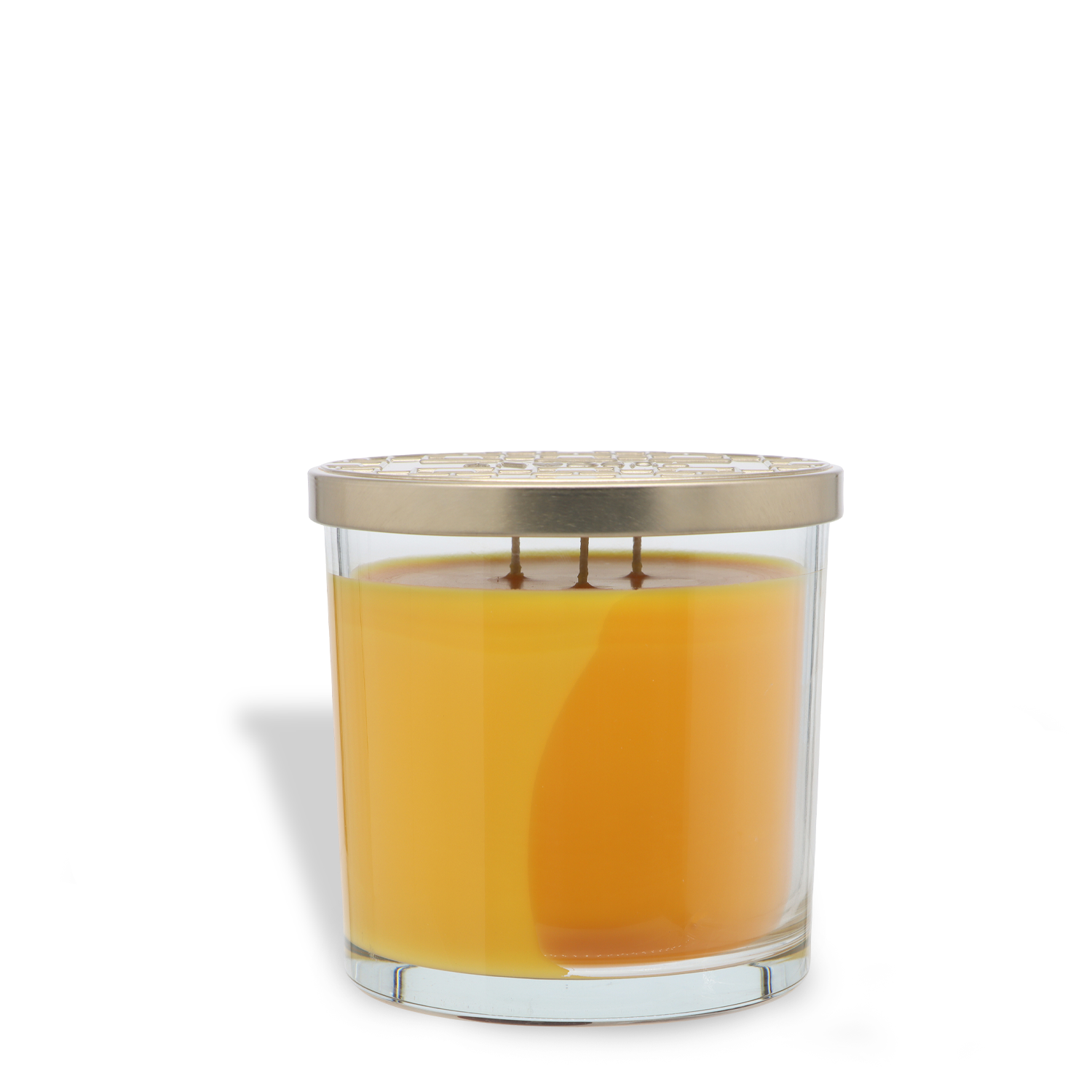 The Tuscany Candle® SEASONAL Fallen Amber: Mandarin & Oak 14 oz candle, featuring orange wax, a metallic lid, and three wicks in a glass jar, is displayed against a plain white background.