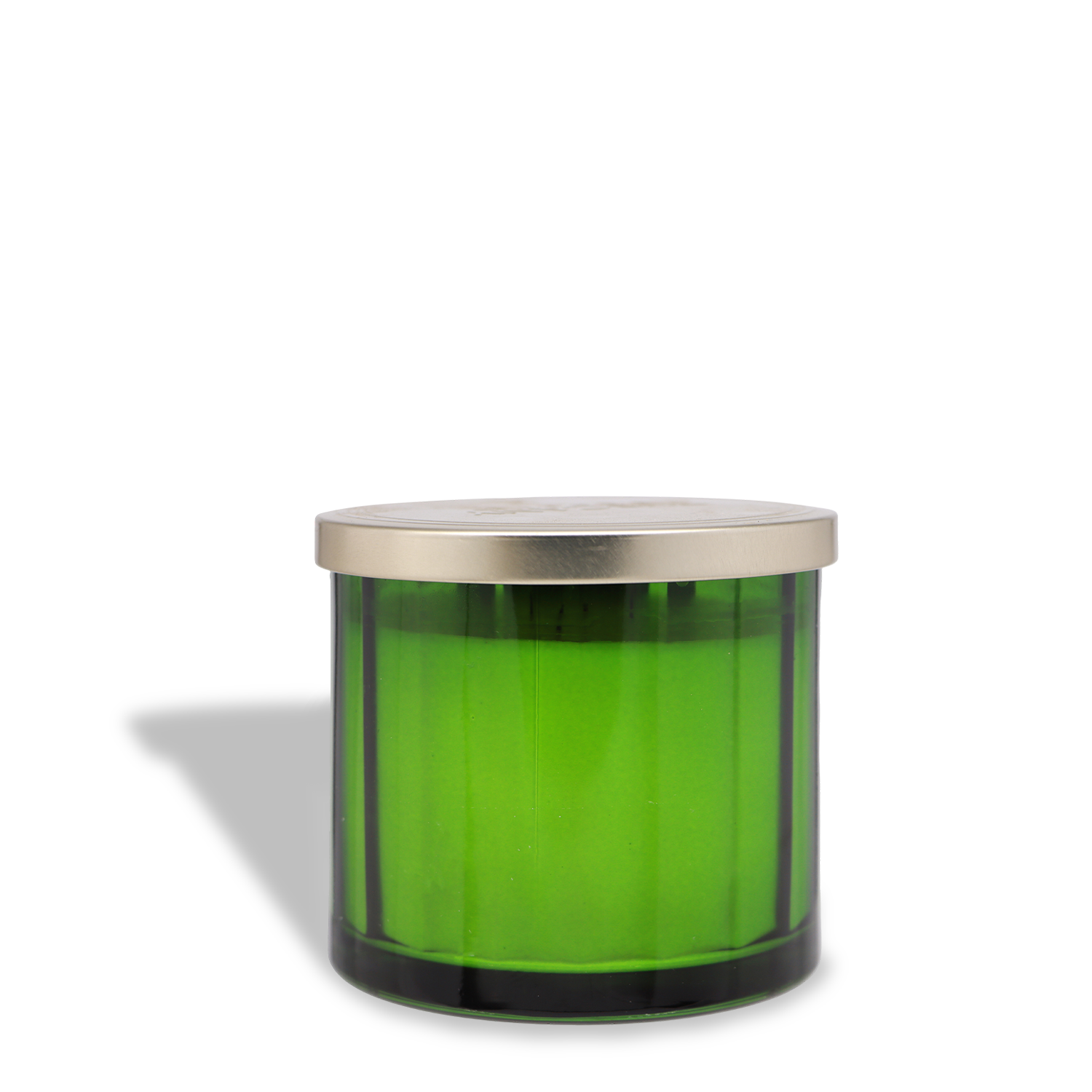 The Tuscany Candle® SEASONAL Autumn Foliage: Citrus & Patchouli Scented Fall Candle (12.5 oz) features a green glass jar with a metallic lid, casting a shadow to the left on a plain white background.