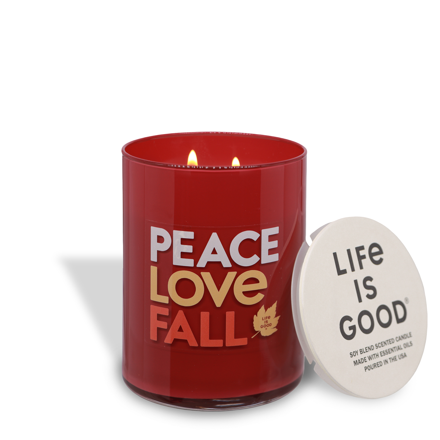 A 13 oz Tuscany Candle® SEASONAL "Peace, Love, & Fall" cinnamon & spice candle with two flames sits beside a white "Life Is Good®" lid.