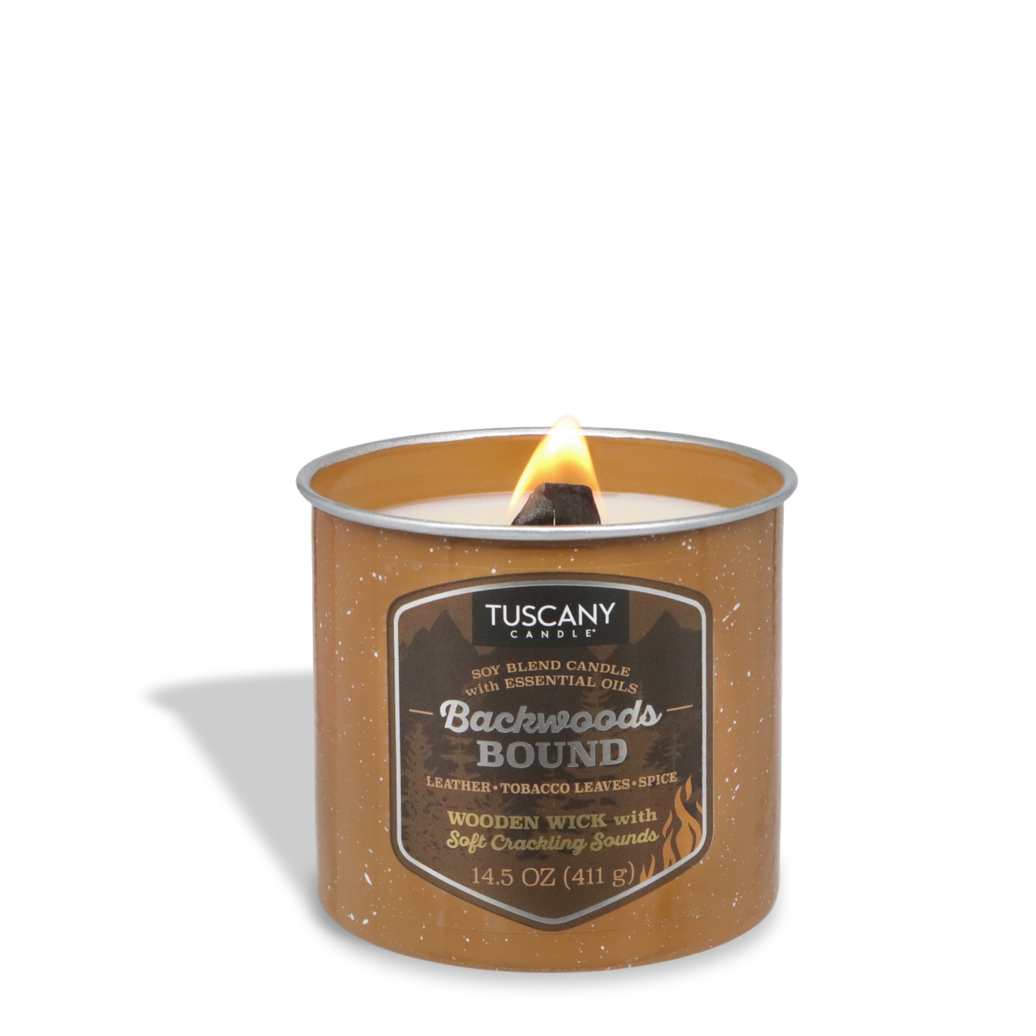 The Tuscany Candle® SEASONAL Backwoods Bound: Leather & Tobacco Scented Fall Wooden Wick Candle (14.5 oz) in a brown tin blends leather, tobacco leaves, and spice for a smoky aroma—perfect for cozy evenings.