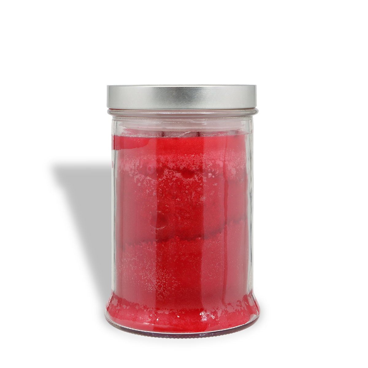 A Warm Gingersnap: Candied Orange & Cedar Scented Holiday Candle (18 oz) by Tuscany Candle® SEASONAL in a clear glass jar filled with red wax and topped with a silver lid.