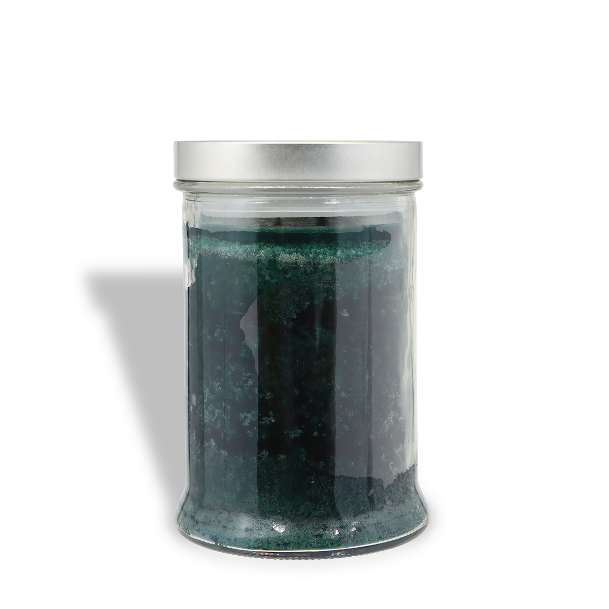 Dark green Frosted Woods: Fresh Fir & Spruce Scented Holiday Candle (18 oz) in a glass jar with a silver lid.