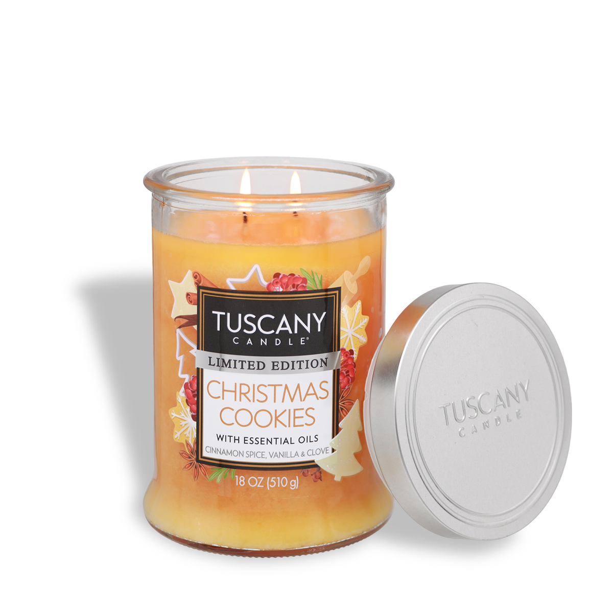 Tuscany Candle® SEASONAL Christmas Cookies: Cinnamon Spice & Vanilla Scented Holiday Candle in a clear, two-wick glass jar with orange wax, a holiday-themed label, and a separate silver lid.