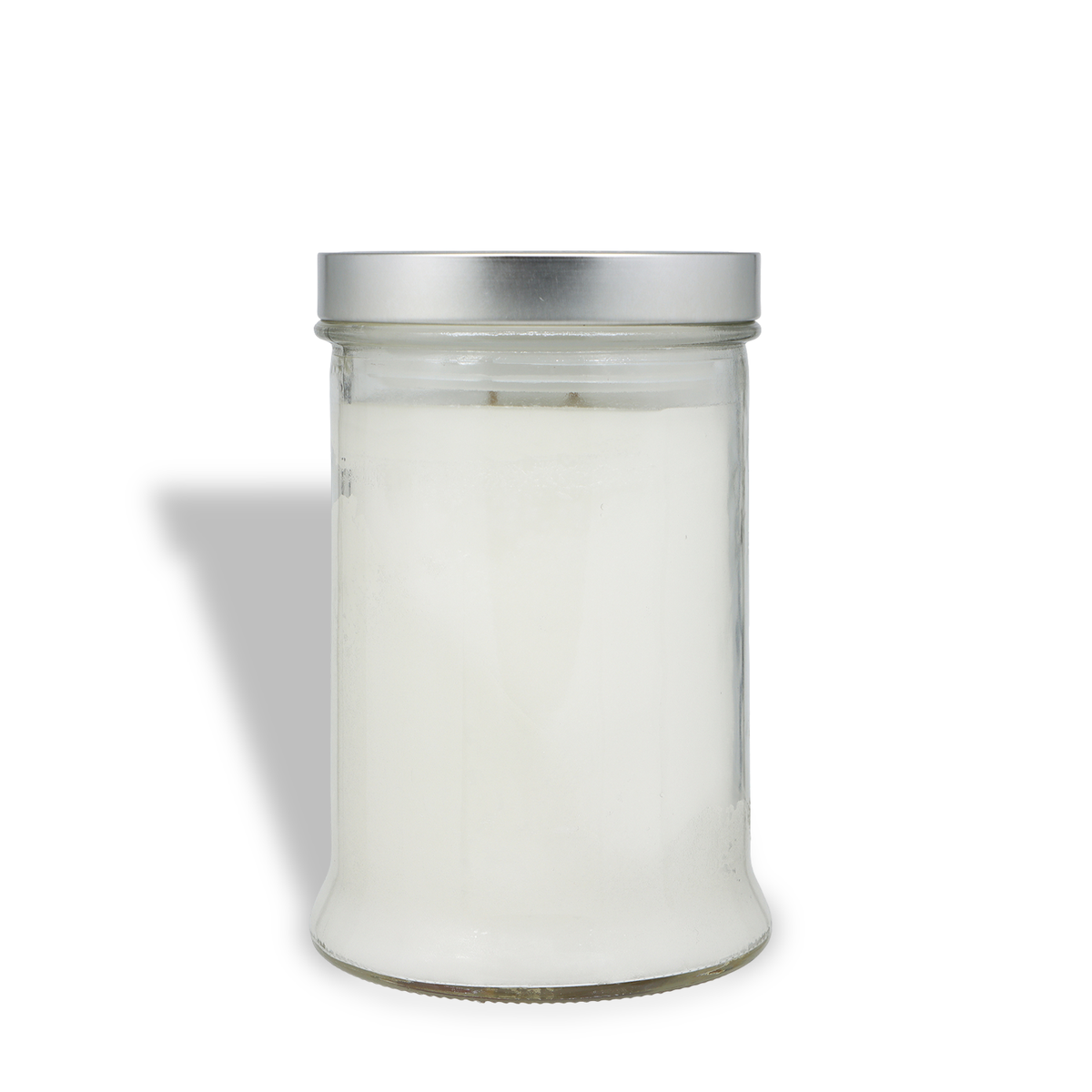A Morning Snowfall: Eucalyptus & Winter Woods Scented Holiday Candle (18 oz) in a clear glass jar filled with white wax and topped with a silver metal lid.