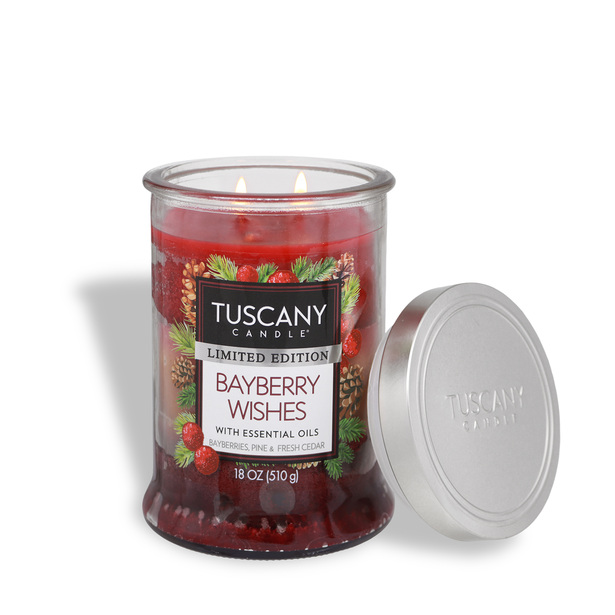 Tuscany Candle® SEASONAL Bayberry Wishes: Bayberries & Pine Scented Holiday Candle (18 oz) in a two-wick red glass jar with a silver lid, decorated with a label featuring pine branches and pinecones.