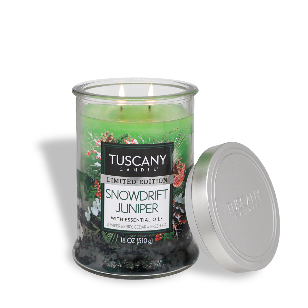 Tuscany Candle® SEASONAL Snowdrift Juniper: Juniper Berry & Fresh Pine Scented Holiday Candle in a two-wick green glass jar with a silver lid and holiday greenery imagery.