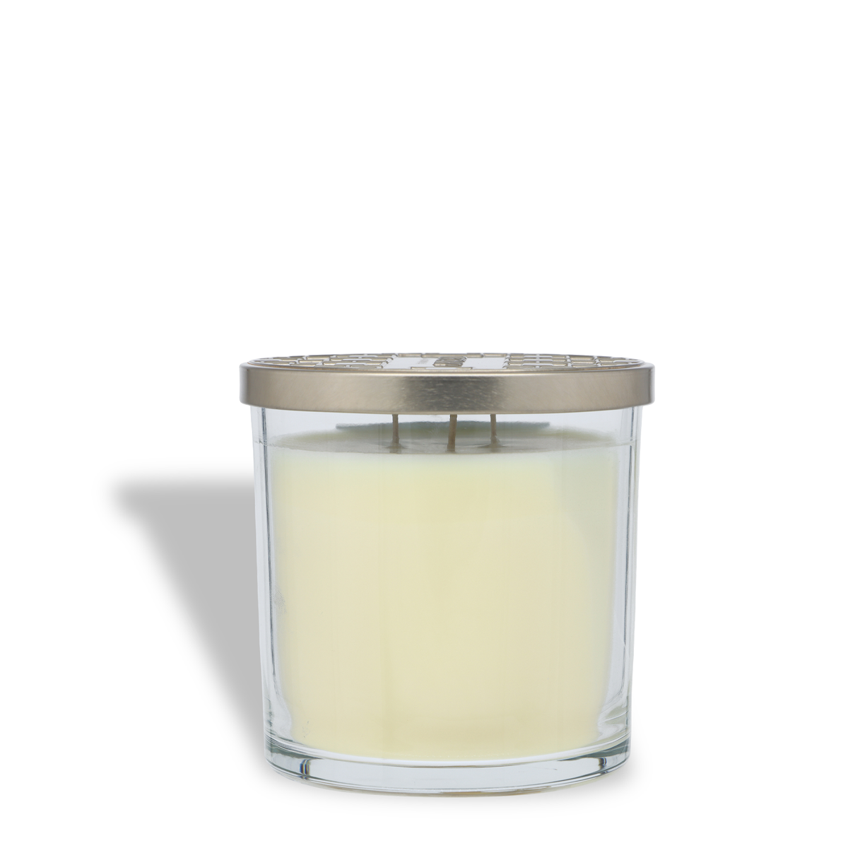Mrs. Claus’s Cookies: Almond & Cardamom Scented Holiday Candle (14 oz) in a clear glass jar with a metallic decorative lid and three wicks.