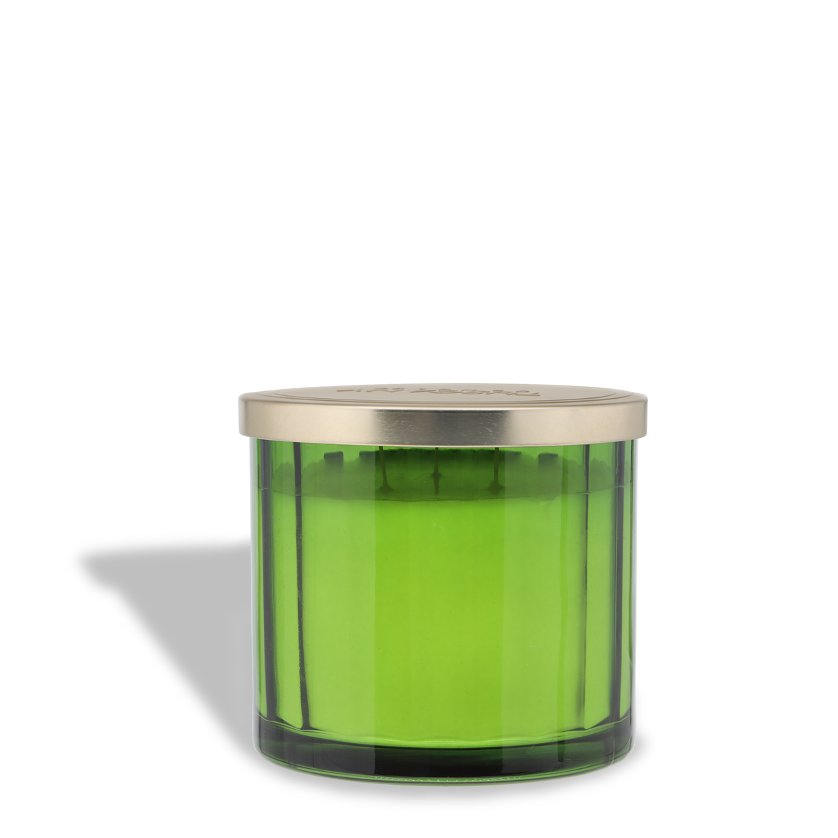 A green, three-wick Tuscany Candle® SEASONAL Tree Farm: Warm Birchwood & Pine Scented Holiday Candle (12.5 oz) in a glass jar with a metallic lid.