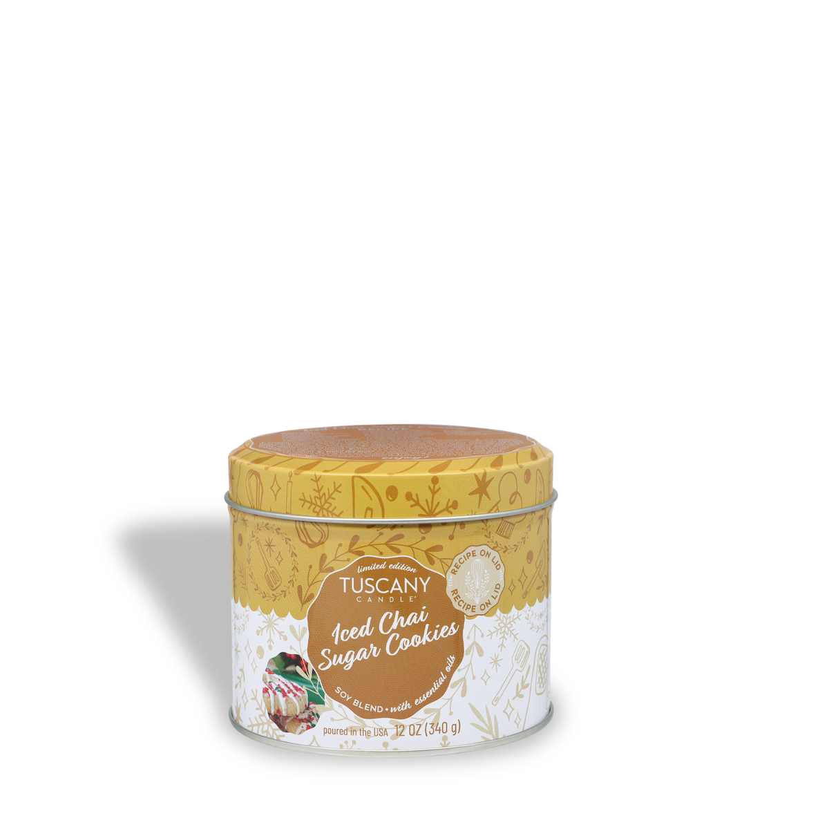 A 12 oz Iced Chai Sugar Cookies: Vanilla & Buttercream Scented Holiday Candle by Tuscany Candle® SEASONAL in a yellow decorative tin with a lid featuring a recipe.