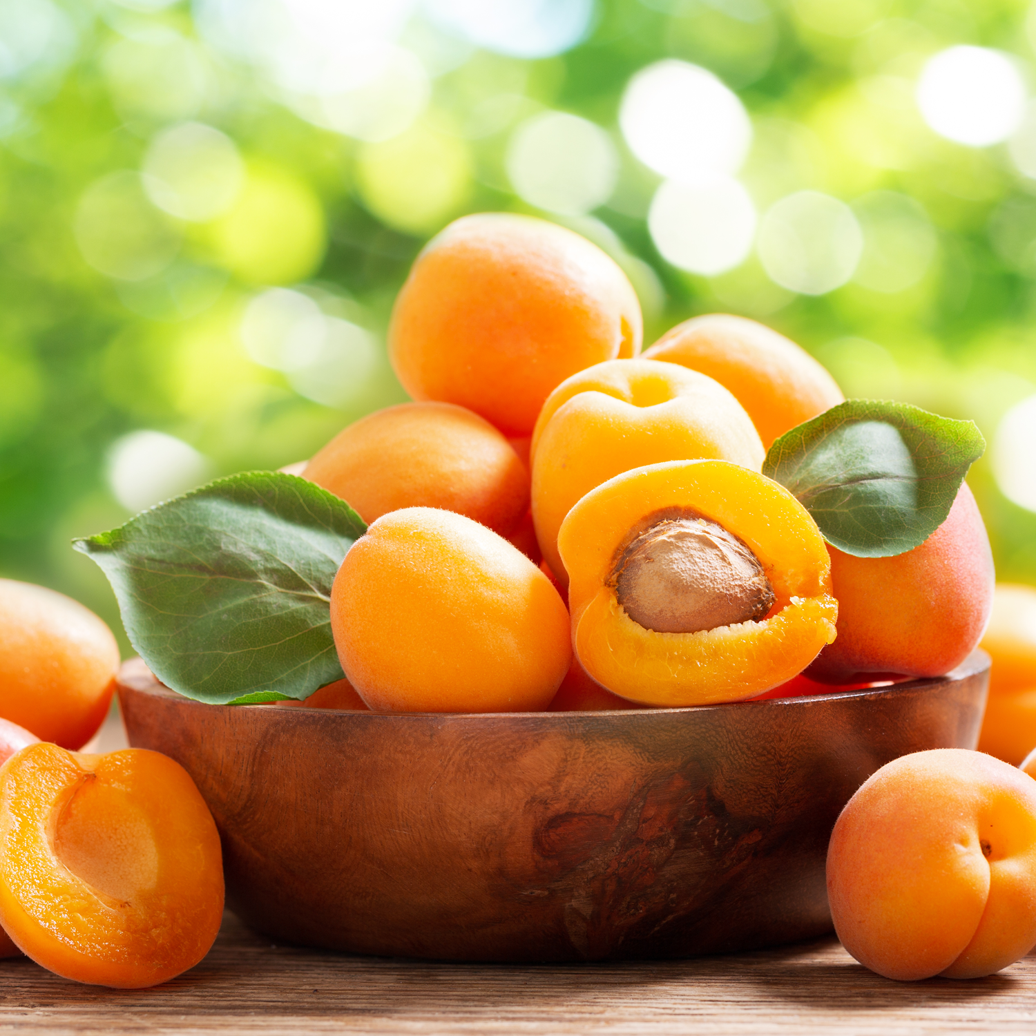 A still life photo of fresh apricots - one of the fragrance notes found in the "Citrus Sunrise" scented candle from Tuscany Candle