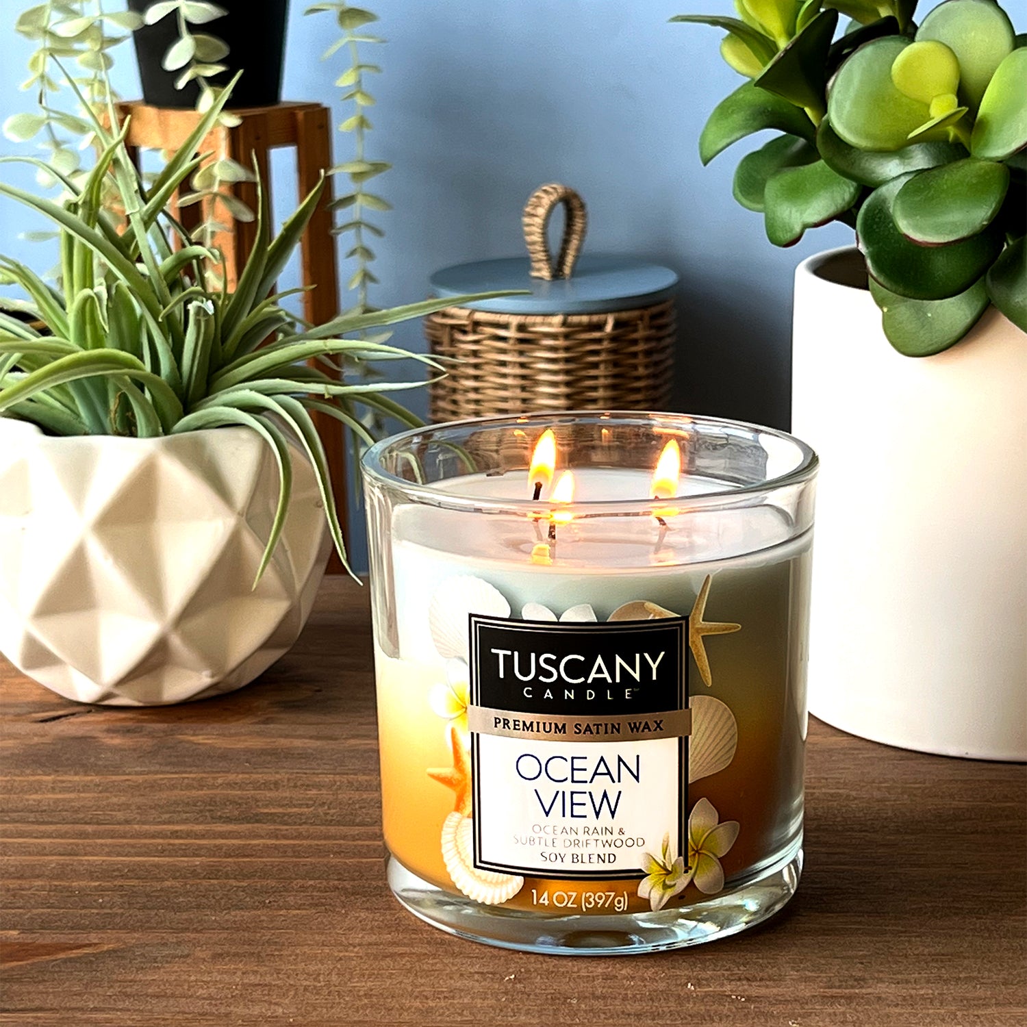 Tuscany Candle® EVD Ocean View Long-Lasting Scented Jar Candle (14 oz) on a driftwood table.