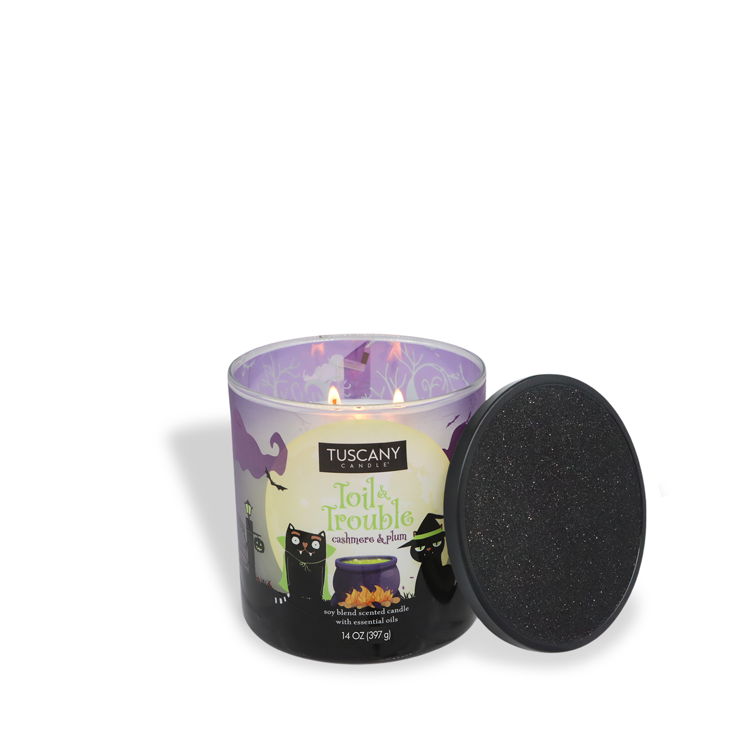 A lit Tuscany Candle® SEASONAL "Toil & Trouble: Sandalwood & Candied Plum" Halloween candle (14 oz) from the Mysteriously Spooky Collection sits by its black lid, featuring a festive design.