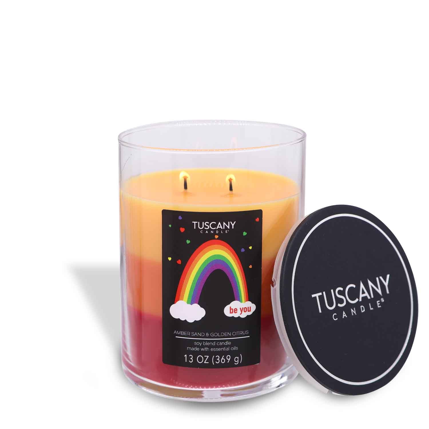 A Be You scented candle (13 oz) from the Pride collection featuring a vibrant rainbow motif by Tuscany Candle® SEASONAL.