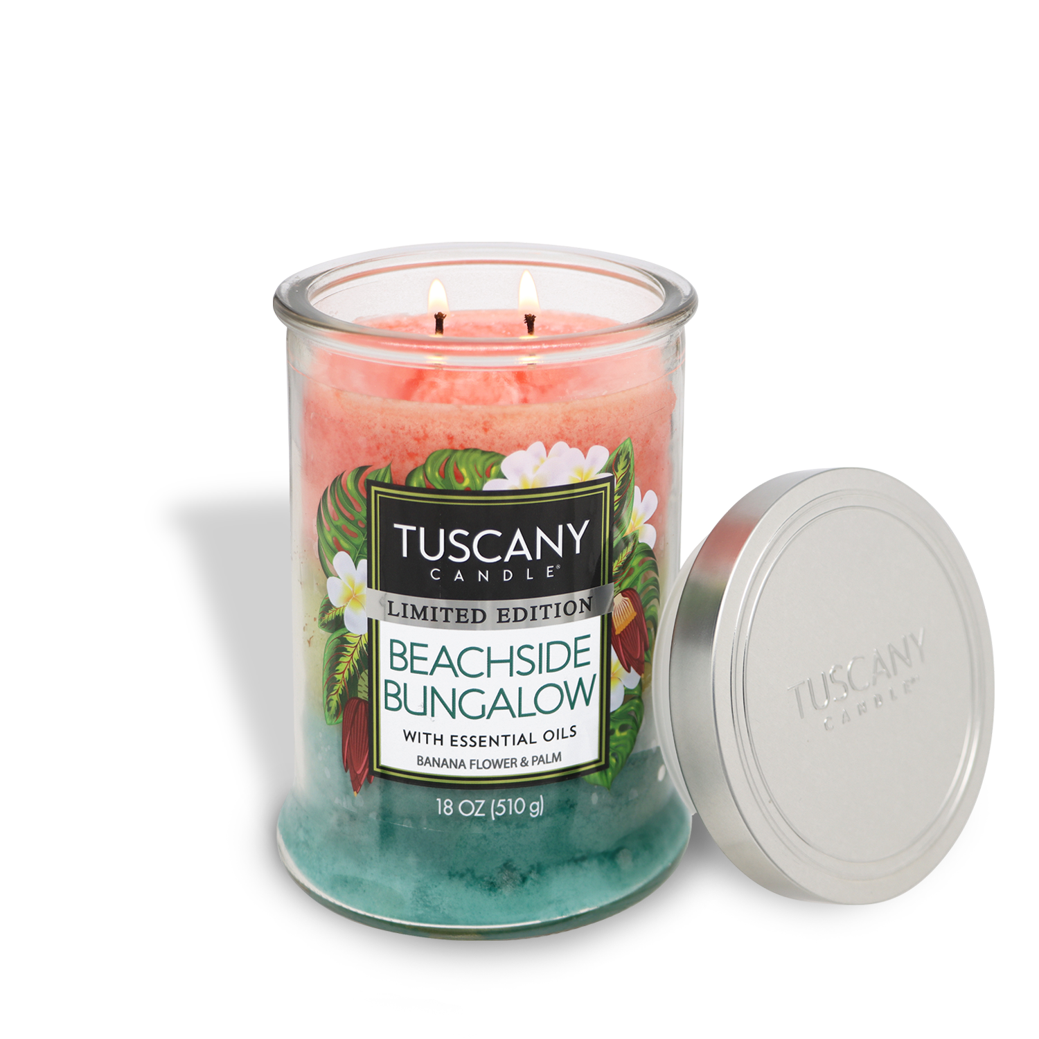 The Tuscany Candle® SEASONAL Beachside Bungalow: Banana Scented Summer Candle (18 oz) features pink and blue wax, essential oils, and a silver lid—delivering a tropical summer vibe to any space.