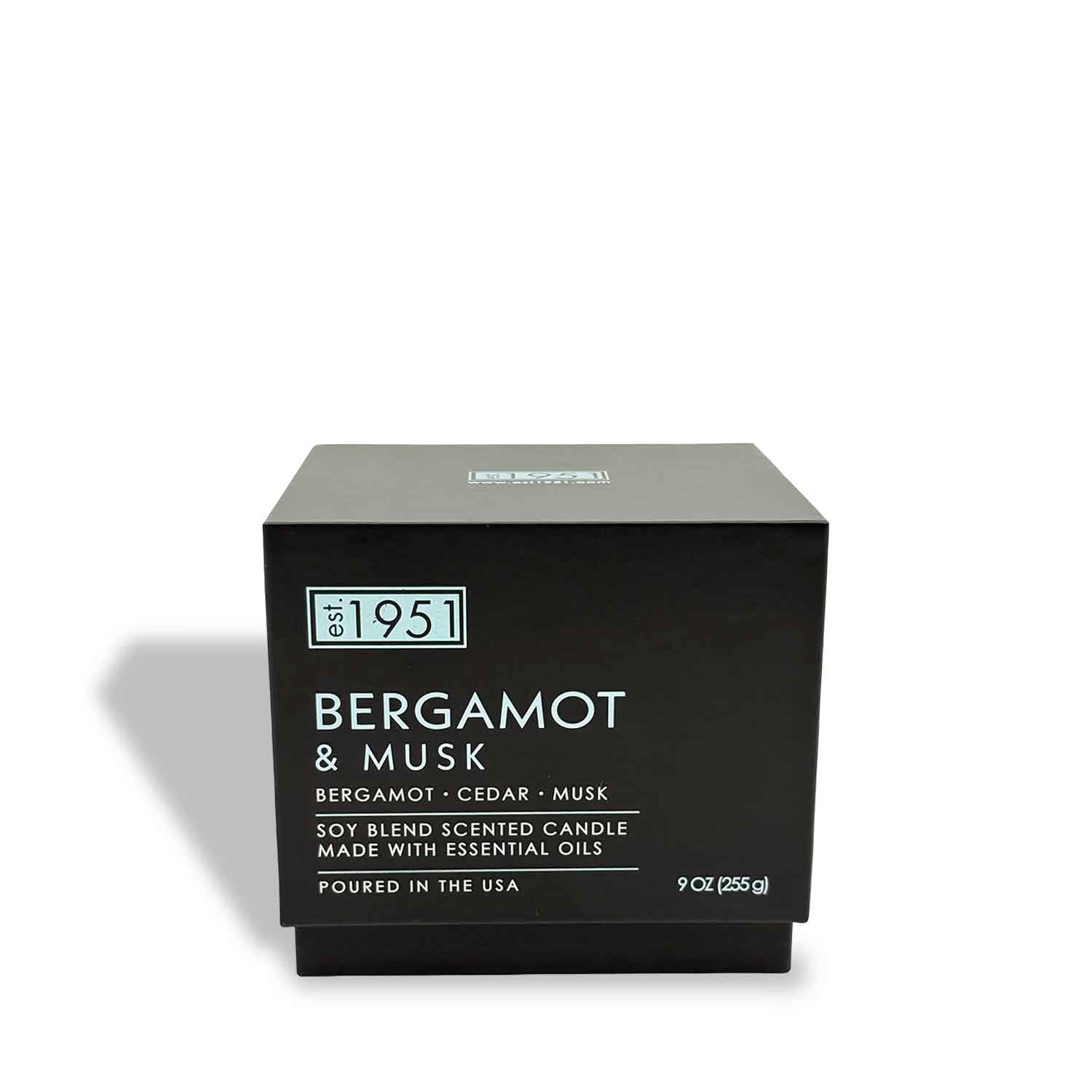 A 9oz double wick candle by est.1951 labeled "Bergamot & Musk," made with vegan wax and essential oils, poured in the USA.
