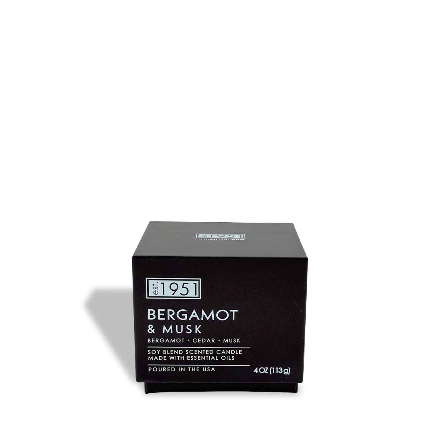The est.1951 Bergamot & Musk 4oz luxury candle comes in a charcoal glass vessel and a black box, featuring a soy blend with notes of bergamot, cedar, and musk.