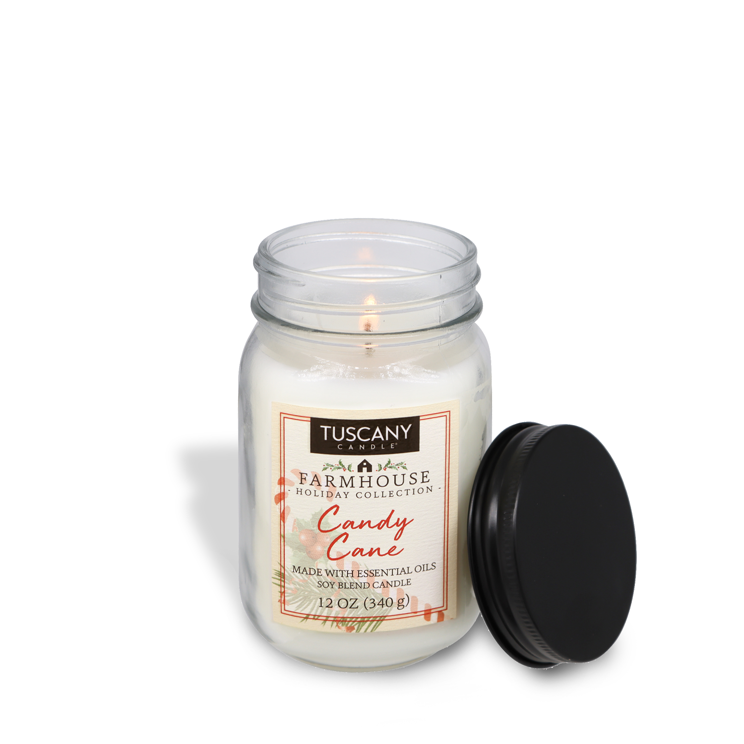 Candy Cane scented candle from the Farmhouse Christmas collection, housed in a mason jar with a matte black lid on a white background