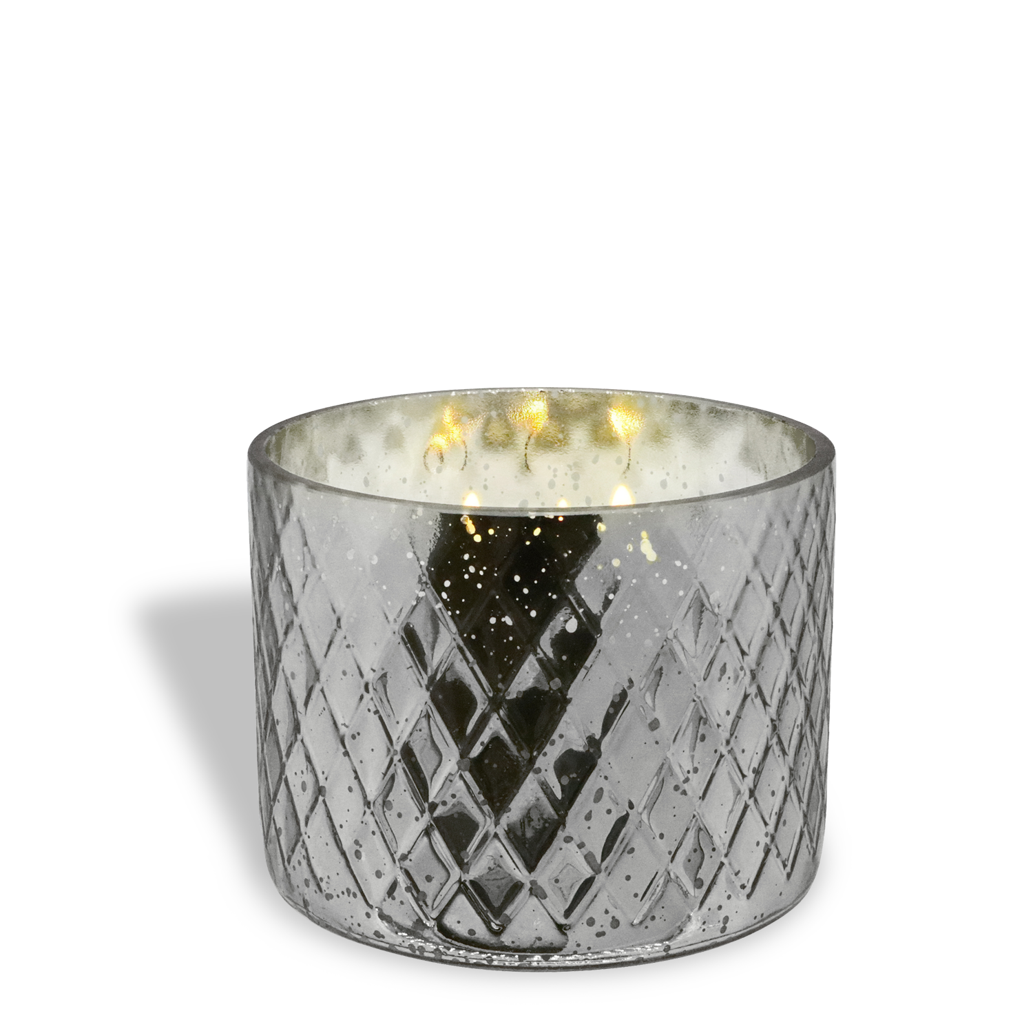 The Cheer The Year: Champagne & Yuzu Scented Holiday Candle (15 oz) by Tuscany Candle® SEASONAL glows softly in a silver glass holder with a diamond pattern, casting a warm light and subtle reflections on the surface.