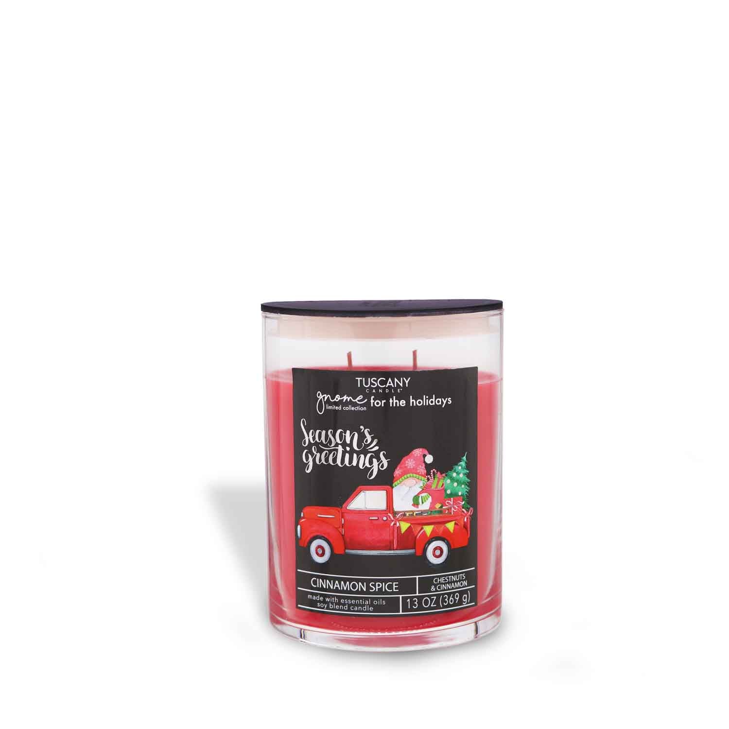 Cinnamon Spice candle from the Gnome for the Holidays collection with vivid red wax, surrounded by festive gnomes on its label, presented against a pristine white background.