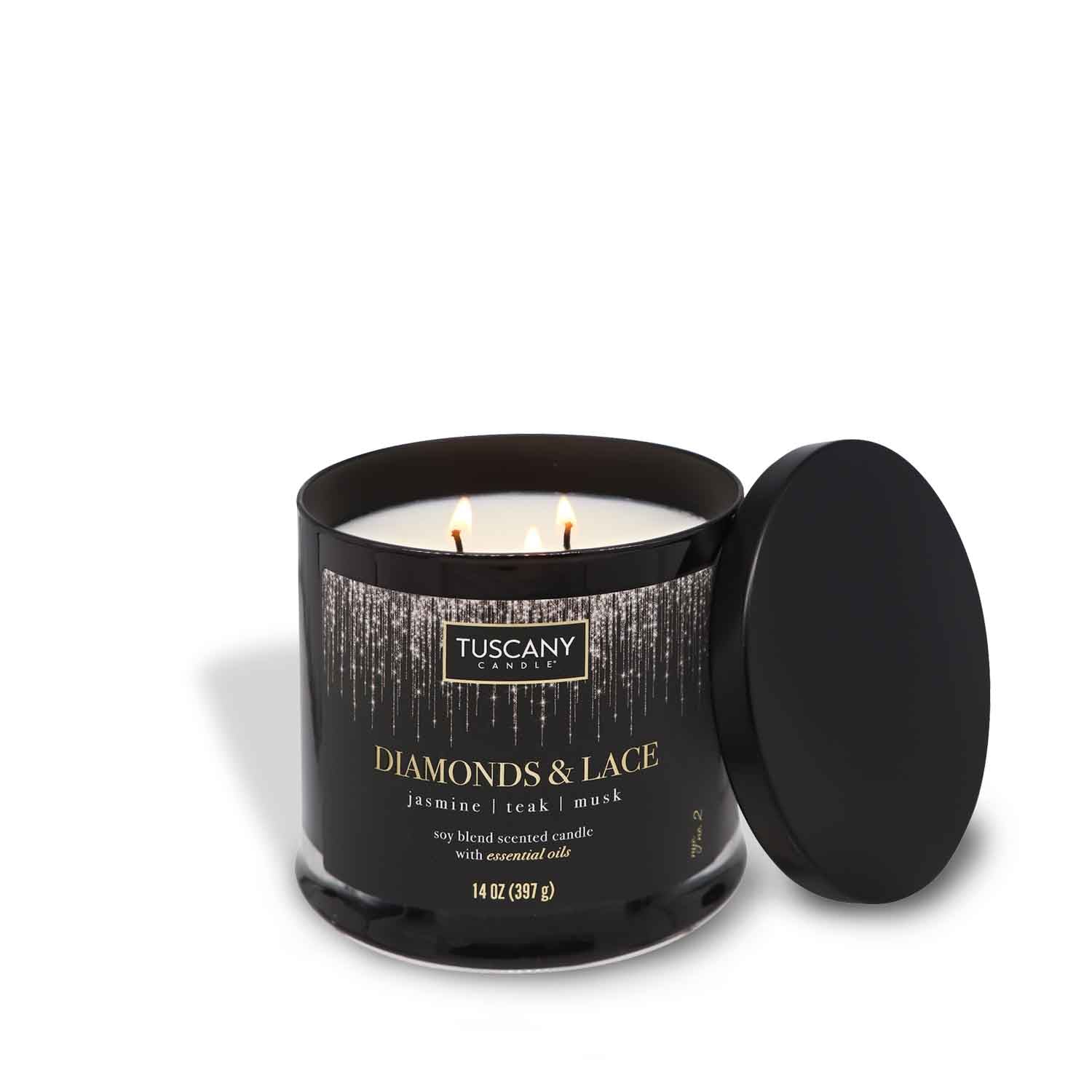 A Tuscany Candle Diamonds & Lace Scented Jar Candle (14 oz) – Celebrations Collection, with a black lid, on a winter nights background.