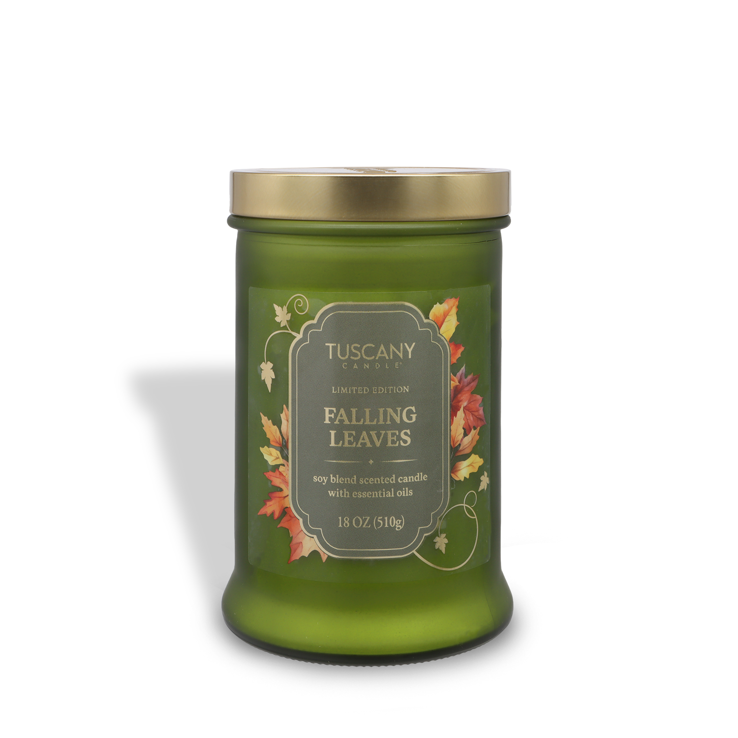 A green glass jar candle, Tuscany Candle® SEASONAL Falling Leaves: Warm Applewood & Amber Scented Fall Candle (18 oz), features autumn leaf designs and a gold lid.