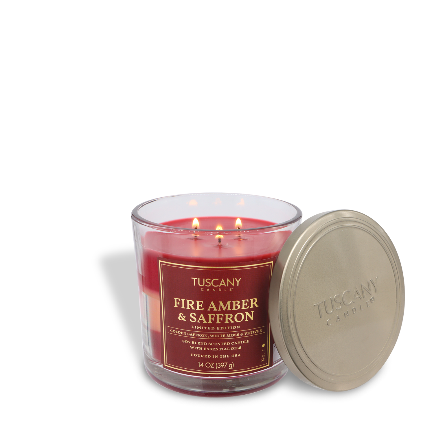 A Tuscany Candle® SEASONAL Fire Amber & Saffron: Vetiver & Moss scented fall candle (14 oz) in a clear glass jar with three wicks and a silver lid.