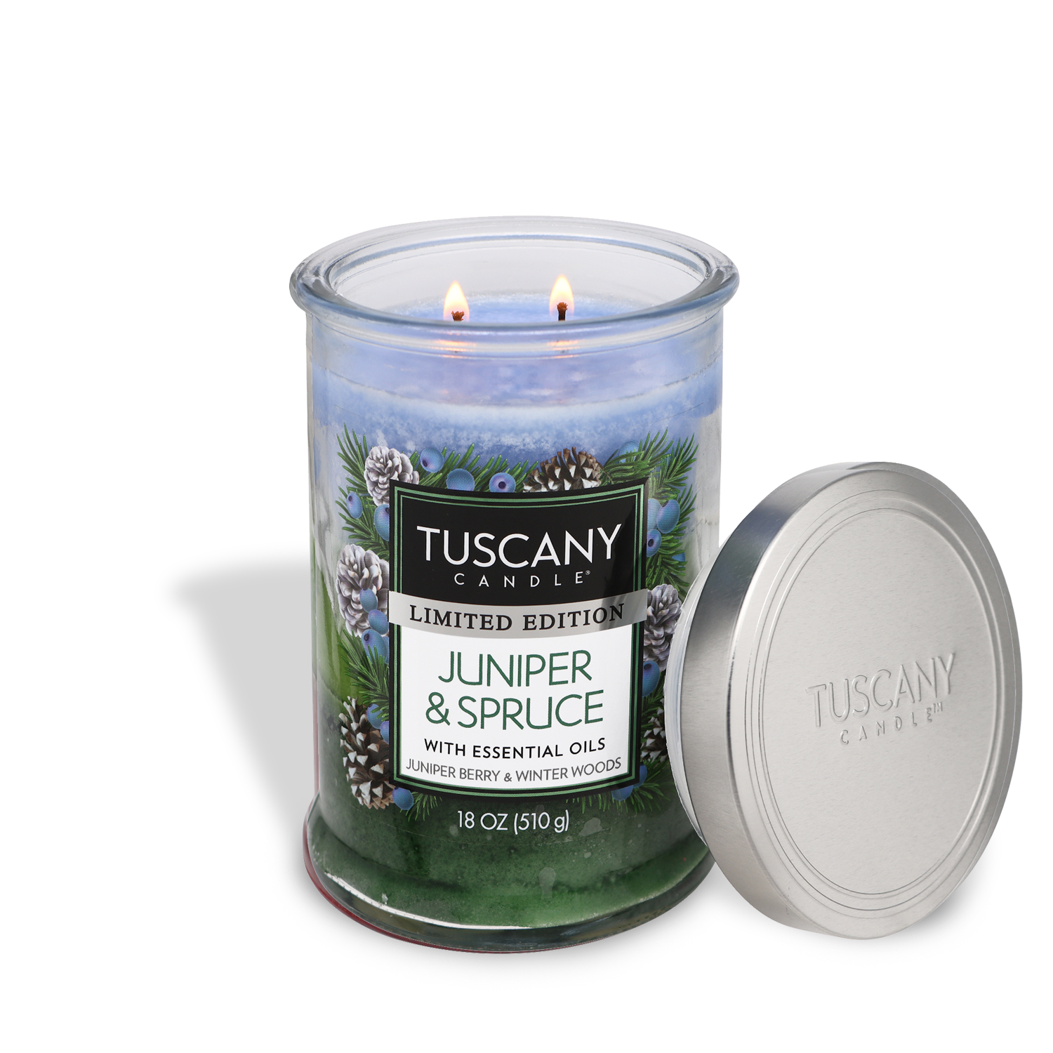 18oz 'Juniper & Spruce' scented candle by Tuscany Candle in a glass jar, showcasing its tri-color layers, reminiscent of sparkling juniper berry, frosty winter woods, and aromatic rosemary.