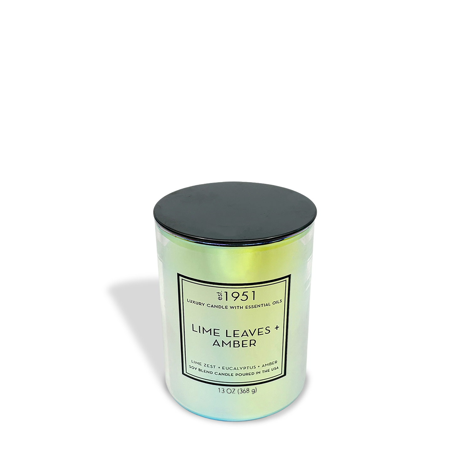 The est.1951 Lime Leaves + Amber (13oz) candle features a cylindrical iridescent jar with a black lid, offering an uplifting citrus and amber scent with essential oils.