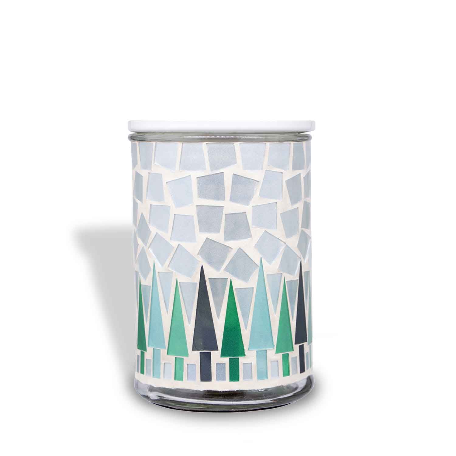 A Tuscany Candle® SEASONAL Mosaic Tree Wax Melt Warmer, perfect as a wax melt warmer, emitting delightful fragrance.